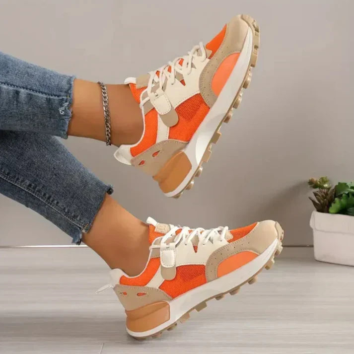 Angle view of modern low-top trainers highlighting the vibrant colour-block design