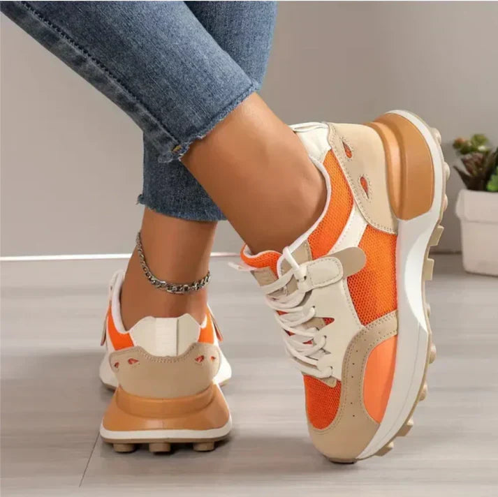 Orange and white colour-block platform trainers for women, casual footwear side view