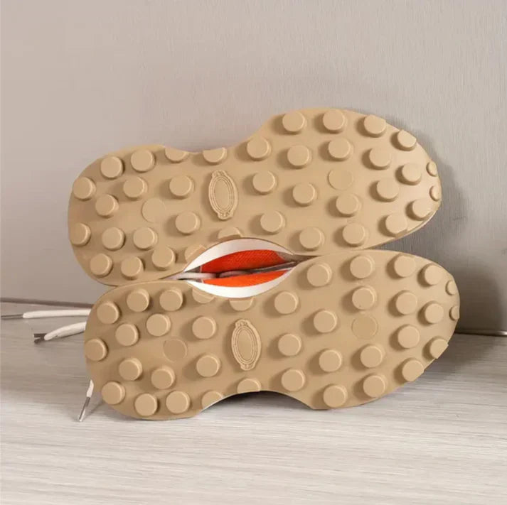 Women's comfortable sneakers in stylish colour-block design with orange accents