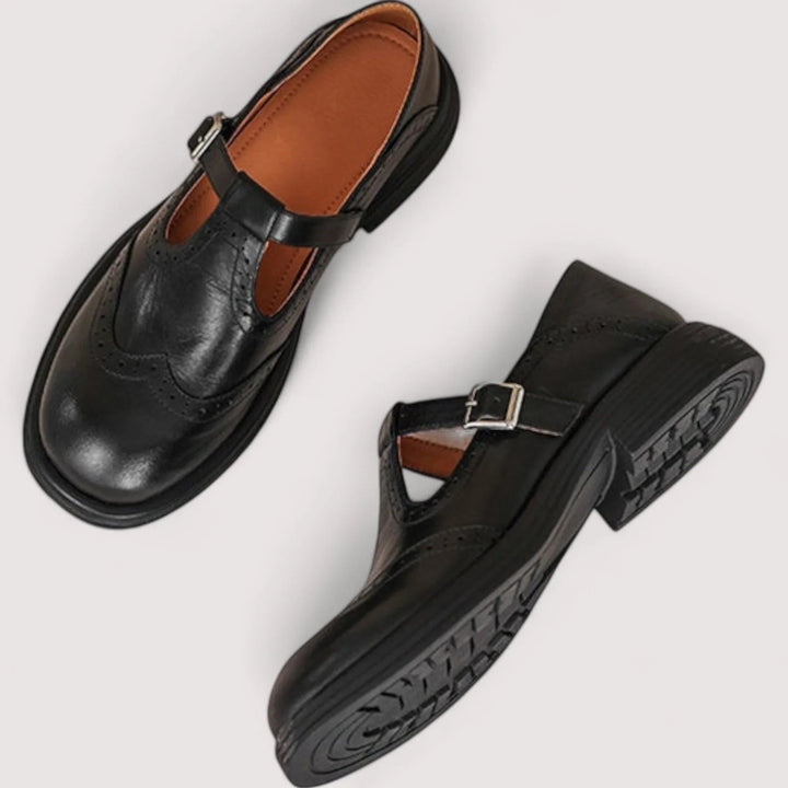 Black Mary Jane shoes shown from top and side angles