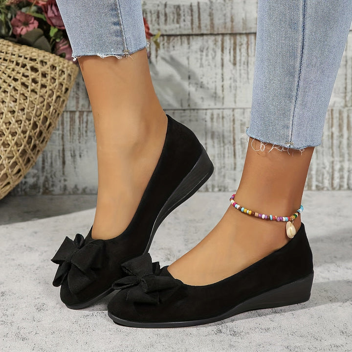 Side angle of women's orthopedic wedge ballet flats with a chic bow detail