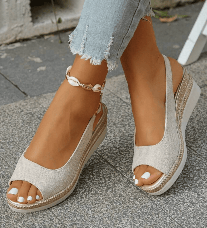 Close-up of comfortable summer wedge sandals featuring cushioned footbed