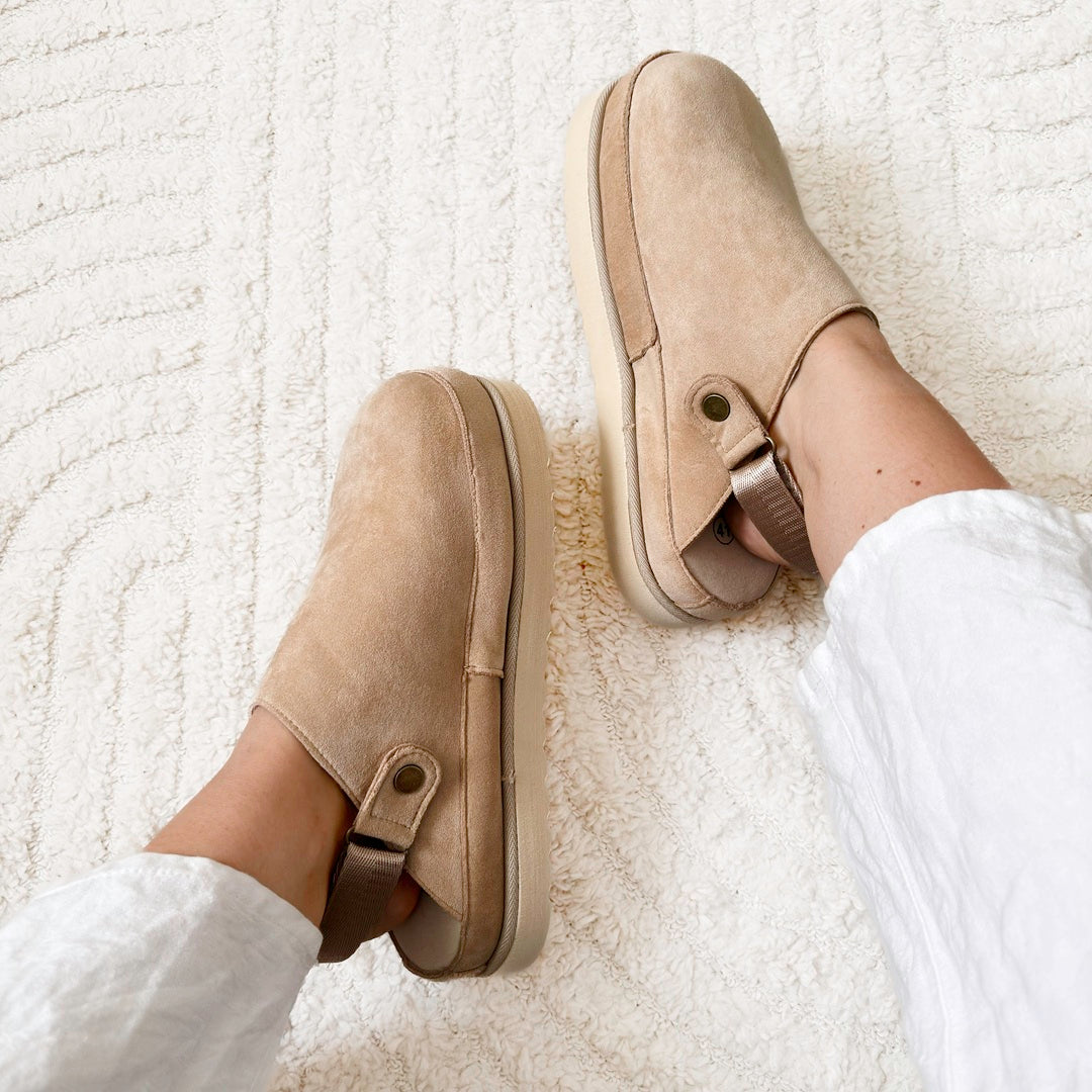 Brown platform clogs for women featuring slip-on design and casual style