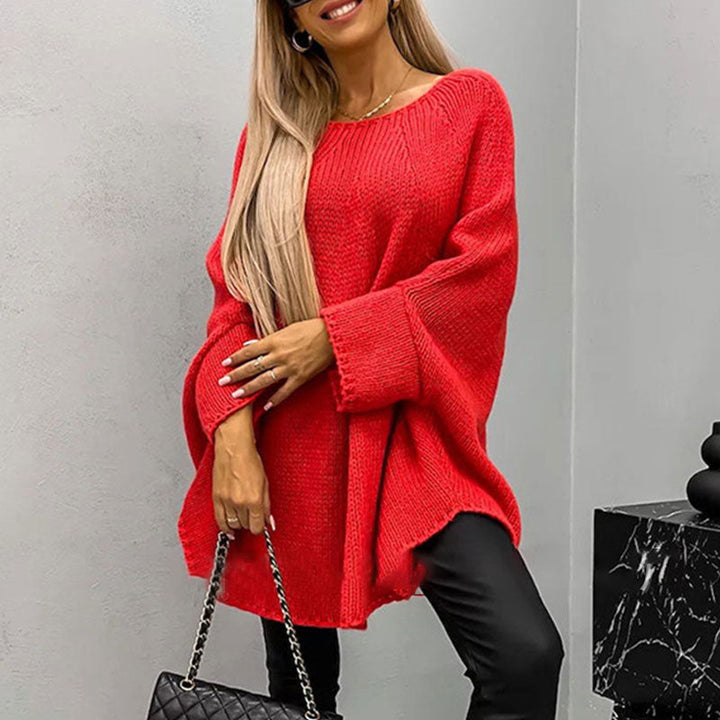 Woman wearing red oversized batwing sleeve knit sweater