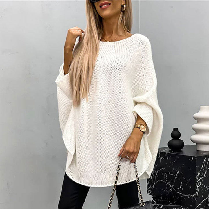 Woman wearing white oversized batwing sleeve knit sweater