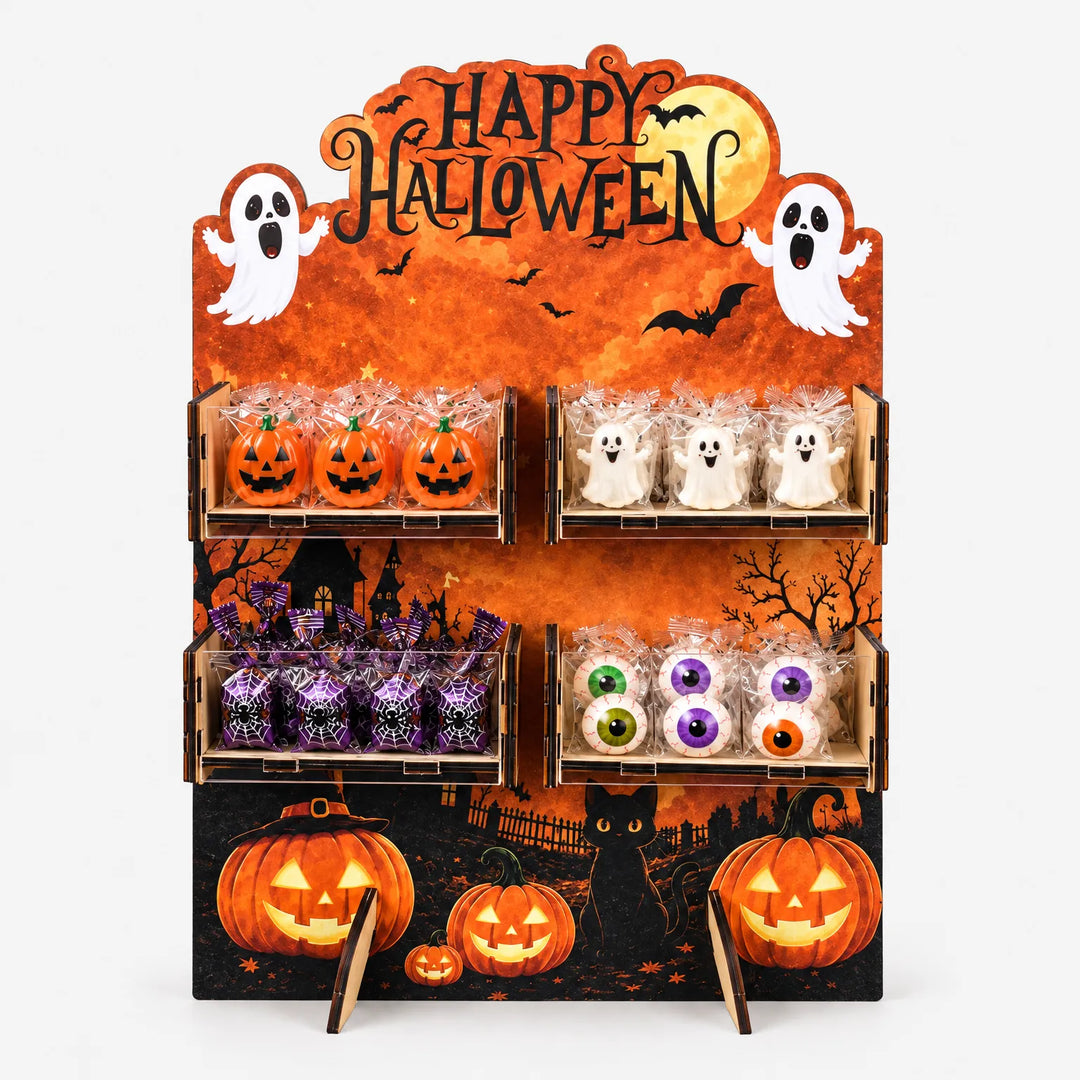 Orange wooden Happy Halloween treat stand filled with spooky snacks