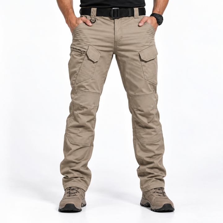 Man wearing beige tactical cargo trousers showcasing ergonomic fit and stance