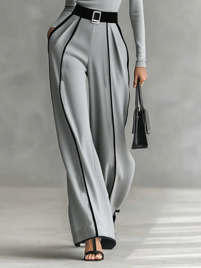Detailed view of the wide-leg pants drape and fall