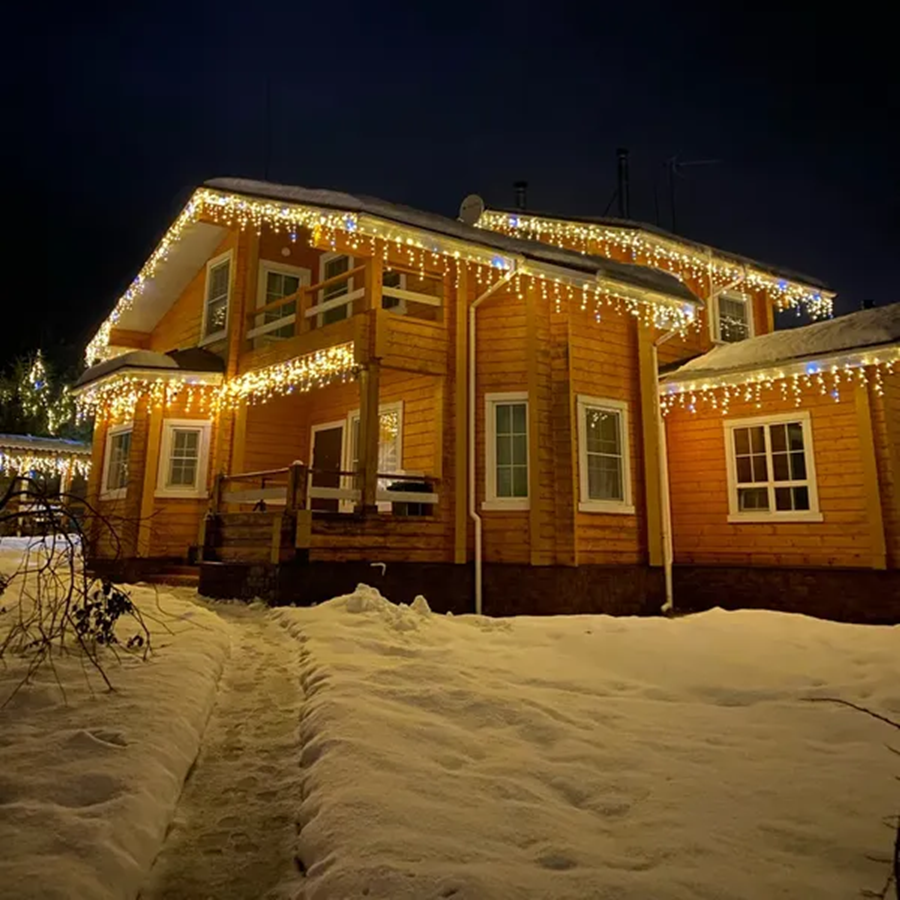 Foxglint warm white LED curtain lights hanging against a wall for holiday ambiance