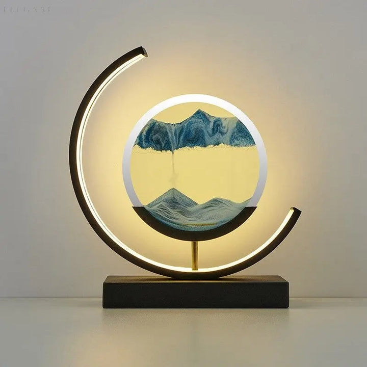 Relaxing kinetic sand art lamp illuminating a cozy home office desk