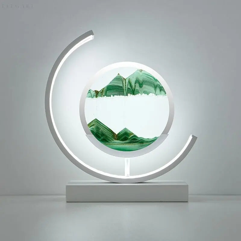 Minimalist desk lamp featuring flowing sand art and warm glow