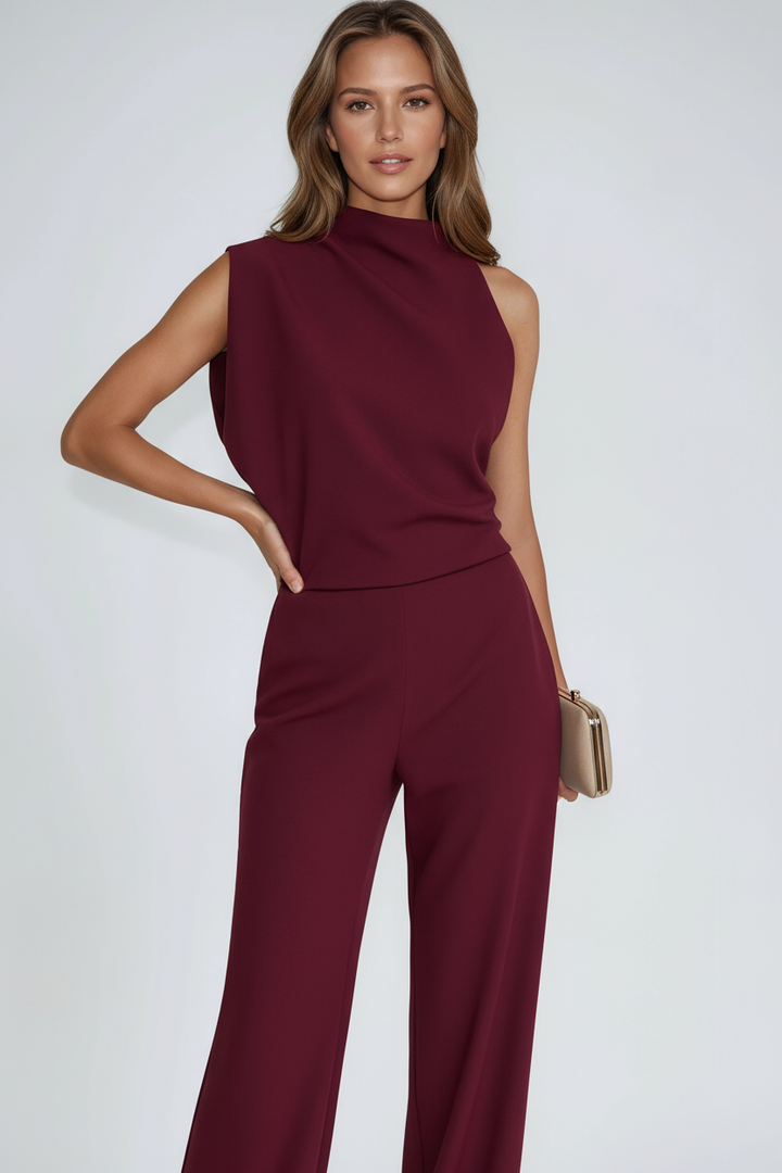 Waistline and draping detail of women's stylish evening wear jumpsuit