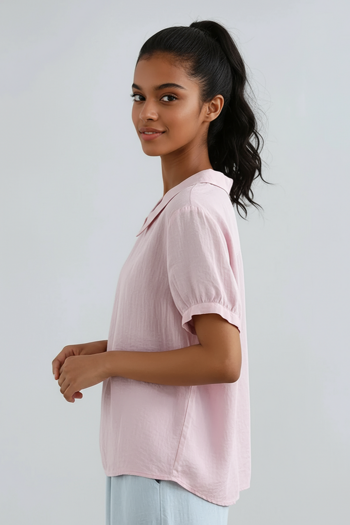Back view of a casual chic women's short sleeve blouse with a relaxed fit.