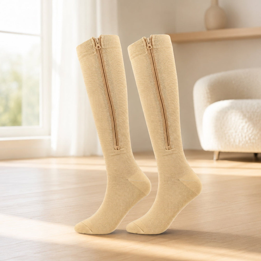 Unisex zip-up compression socks shown open to display the smooth zipper and durable fabric design.