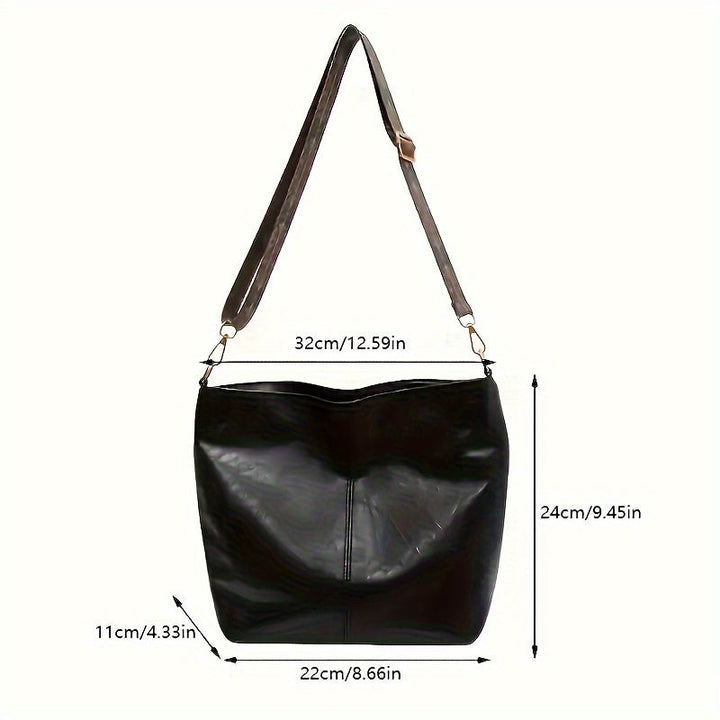 Casual pose highlighting the chic retro vibe of the large shoulder bag