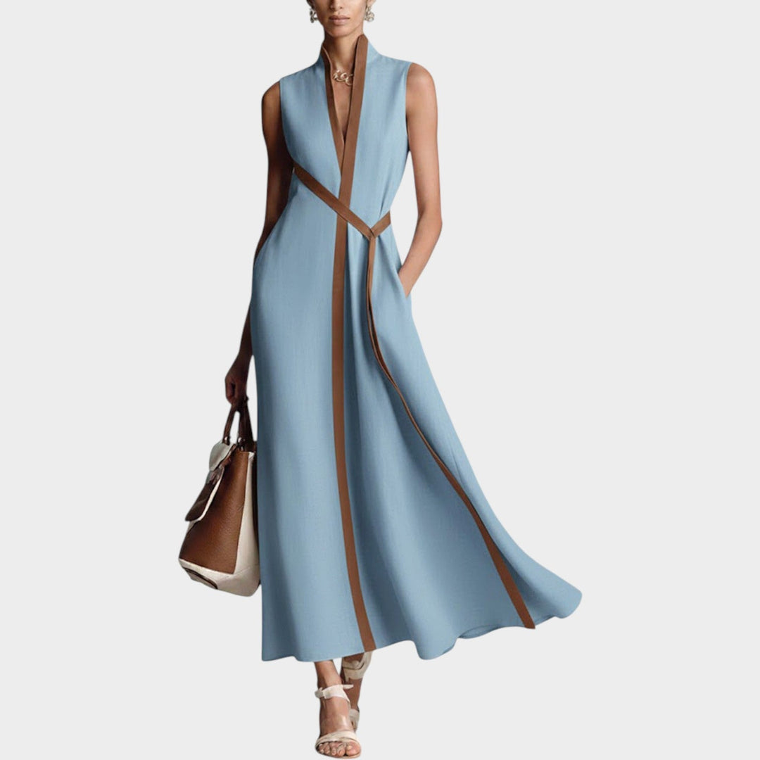 Woman modeling a light blue sleeveless maxi dress featuring a structured contrast trim