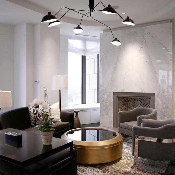 Spacious room illuminated by a large modern multi-arm ceiling light