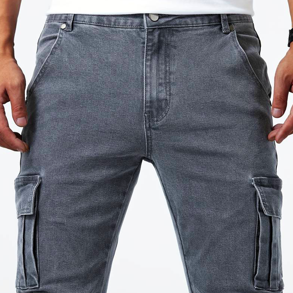 Side view of mens slim fit cargo denim pants showing utility pockets and stretch denim fabric