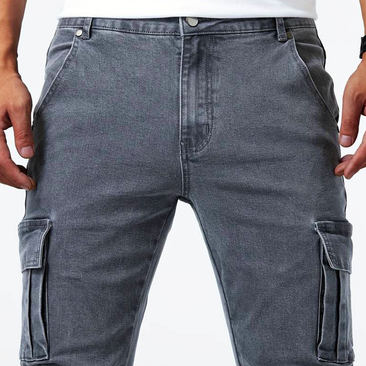 Side view of mens slim fit cargo denim pants showing utility pockets and stretch denim fabric
