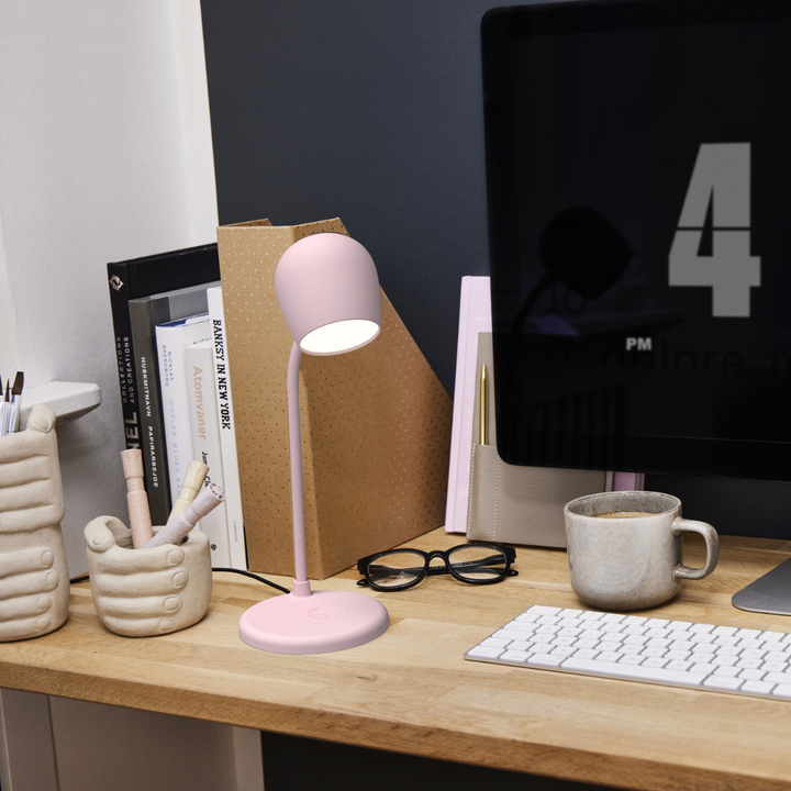 Modern bedside lamp featuring built-in Bluetooth speaker in a cozy bedroom