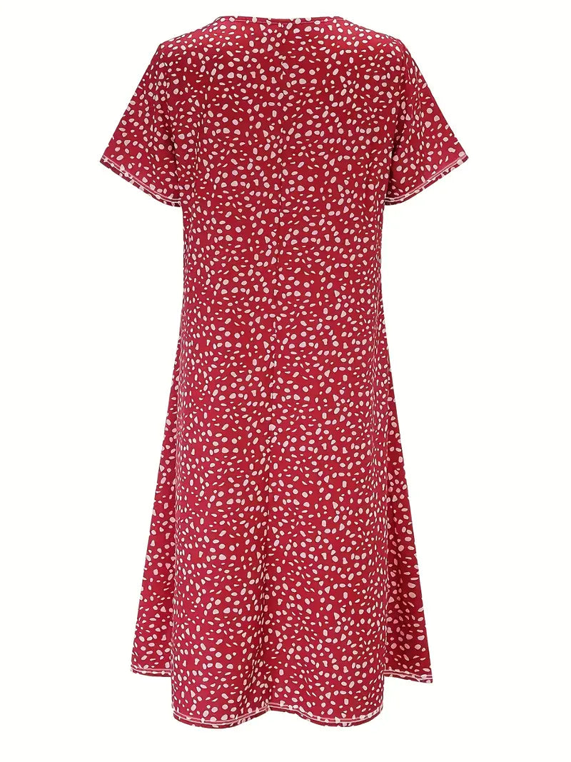 Back view of women's elegant midi dress featuring a flattering fit and print