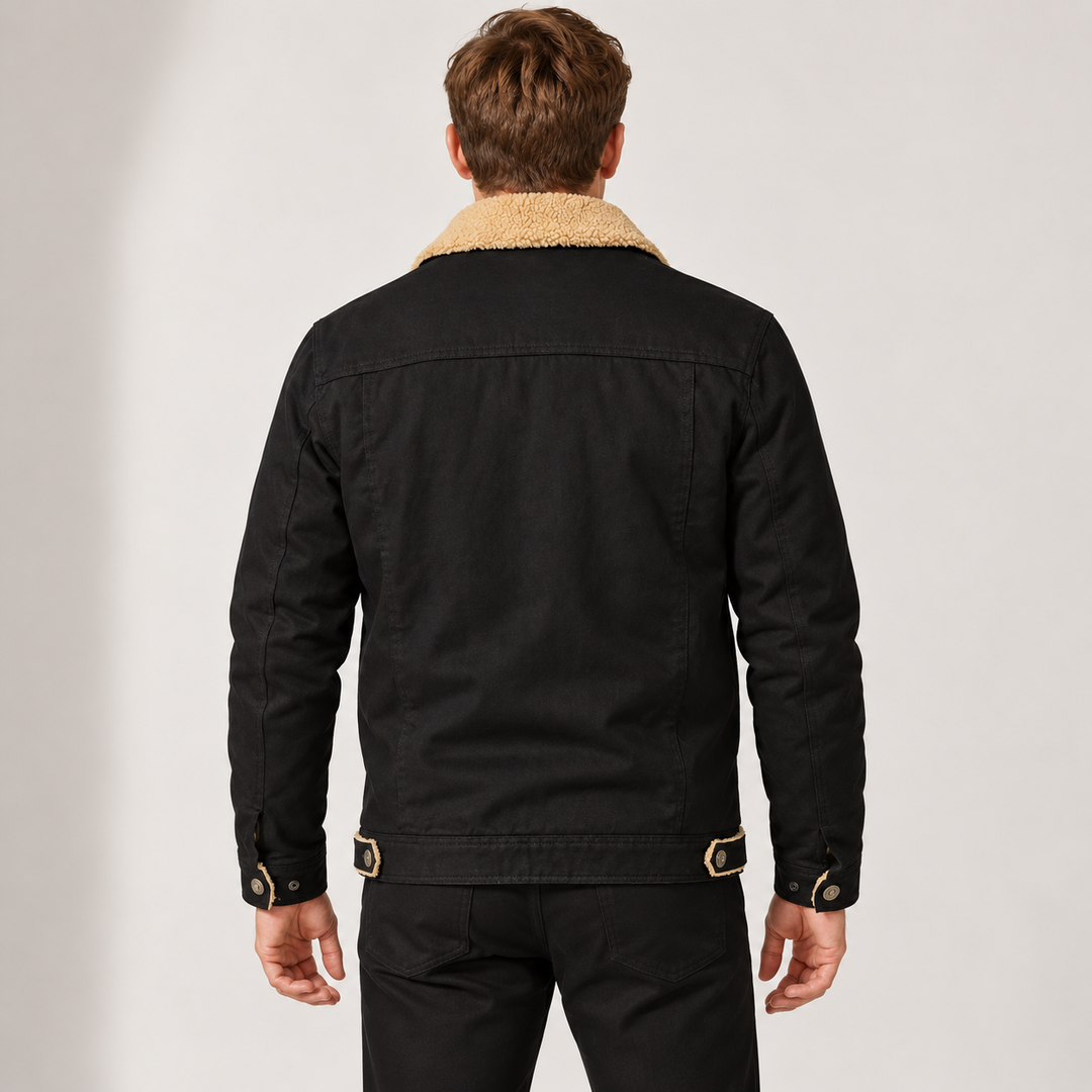 Back view of a man wearing a black trucker jacket with fleece collar details