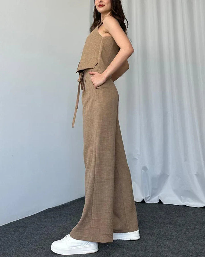 Woman wearing beige two-piece set with vest and wide-leg trousers from the side