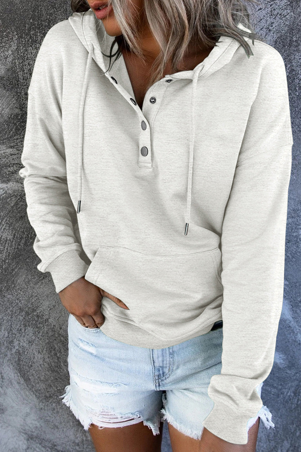 Green women's hoodie paired with casual trousers