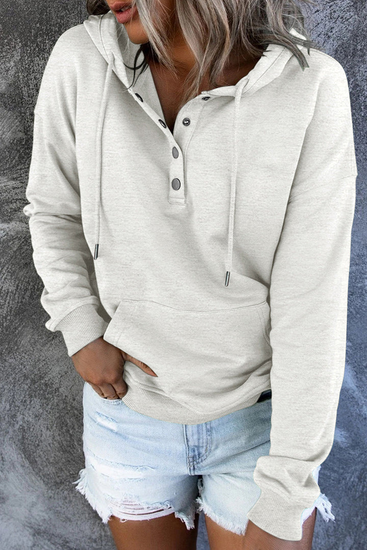 Green women's hoodie paired with casual trousers