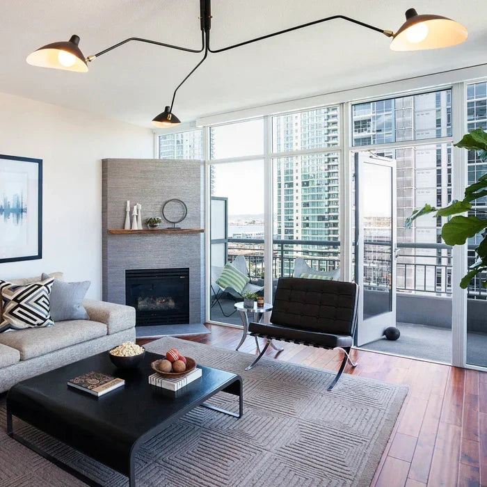 Dynamic swivel arm ceiling light creating layered interior illumination