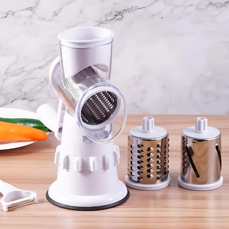 Kitchen vegetable slicer showing the rotary drum and detachable slicing cylinders