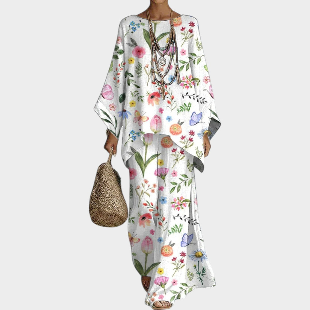 Woman wearing a white boho floral two-piece matching set with wide-leg pants and a relaxed top.