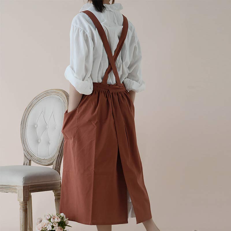 Stack of colorful pink, blue, and beige waterproof aprons together