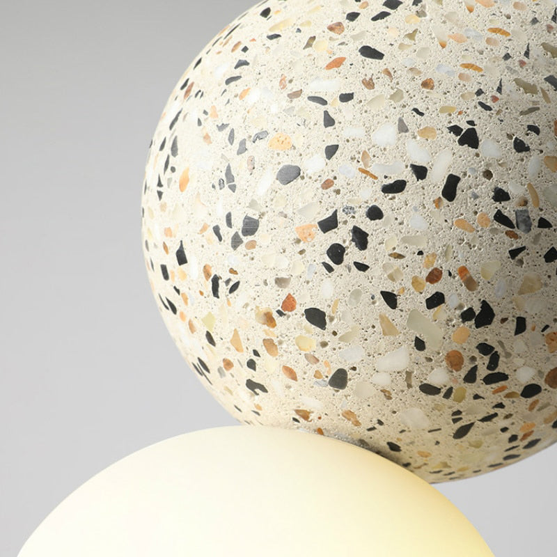 Stylish hanging lamp casting warm ambient interior lighting over a kitchen island