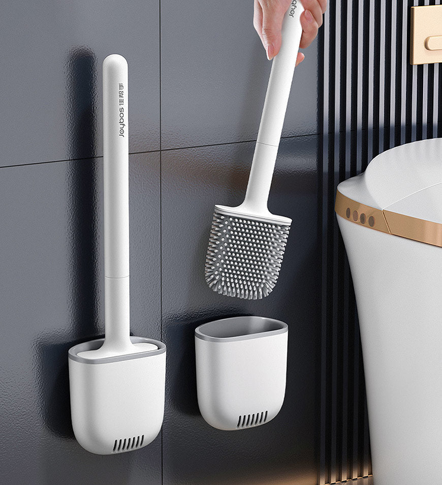 Silicone toilet brush being lifted from its ventilated holder