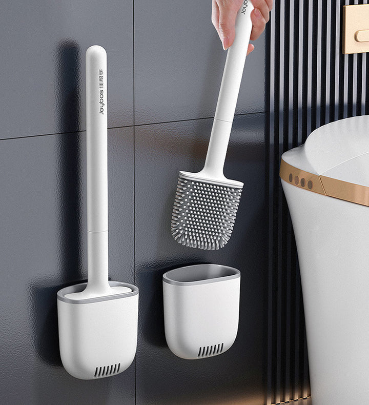 Silicone toilet brush being lifted from its ventilated holder