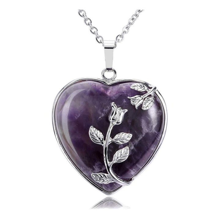 Fashionable heart gemstone necklace displayed gracefully on a bust