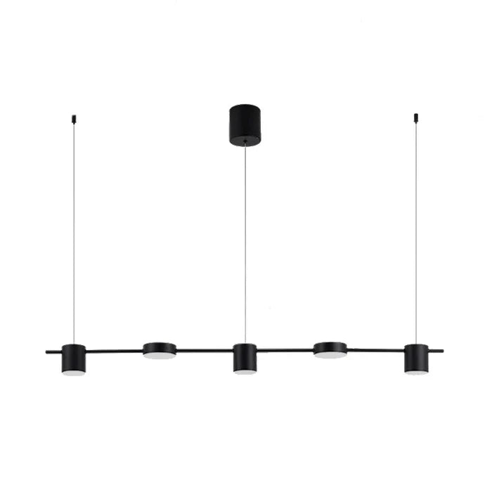 Ambient warm light cast downward by the modern LED hanging lamp at night
