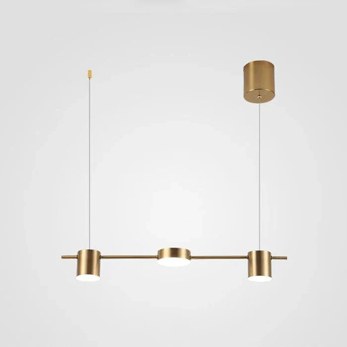 Minimalist aluminum pendant lighting illuminating a contemporary kitchen island