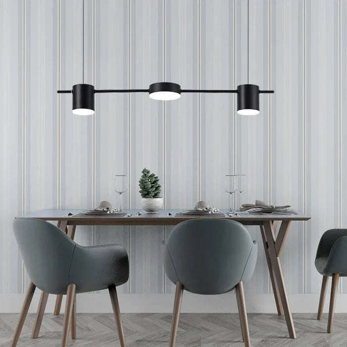 Warm LED illumination glowing from the underside of the aluminum pendant fixture