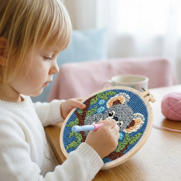 Embroidery hoop with colorful yarn and punch needle tool in DIY kit