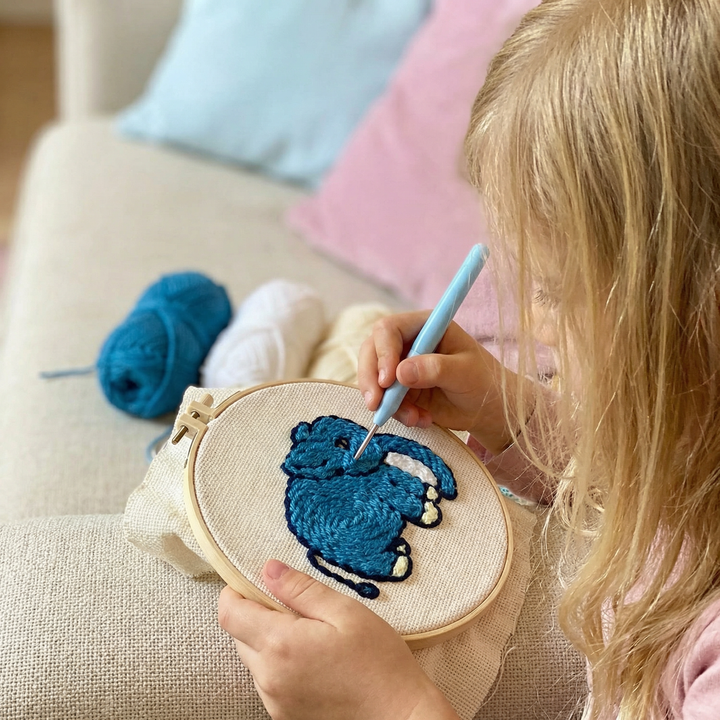 Complete needlework starter set with fabric, hoop, and threads