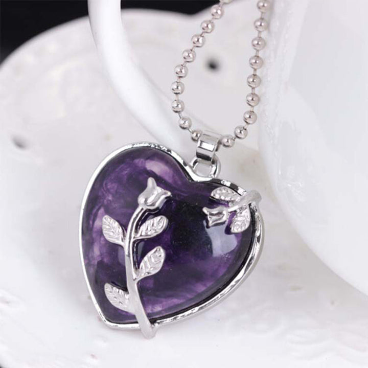 Elegant women's necklace featuring a polished heart shaped crystal pendant