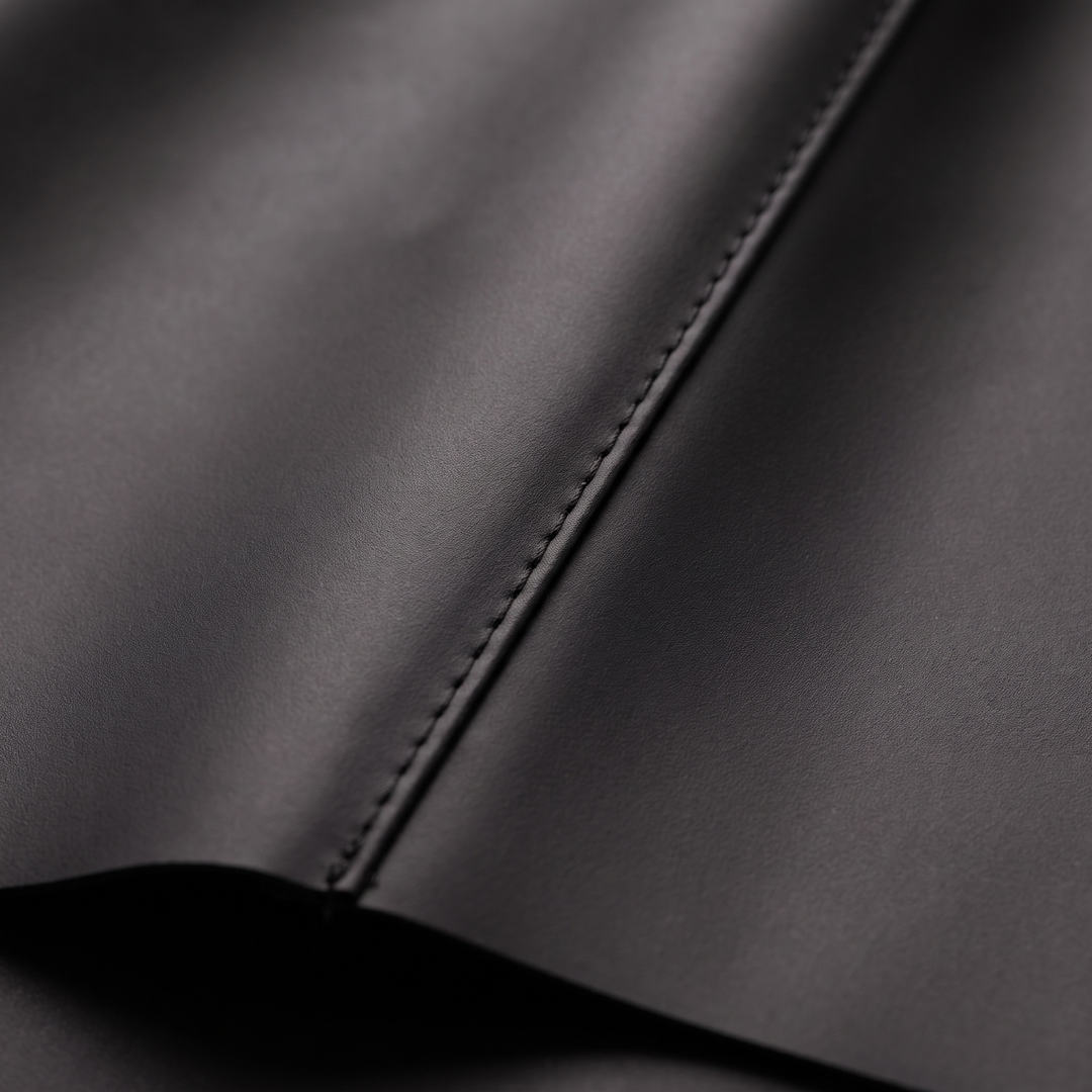 Back view of mens black weatherproof travel rain coat outerwear