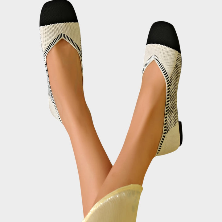 Pair of brown breathable woven women's ballet flats on neutral background