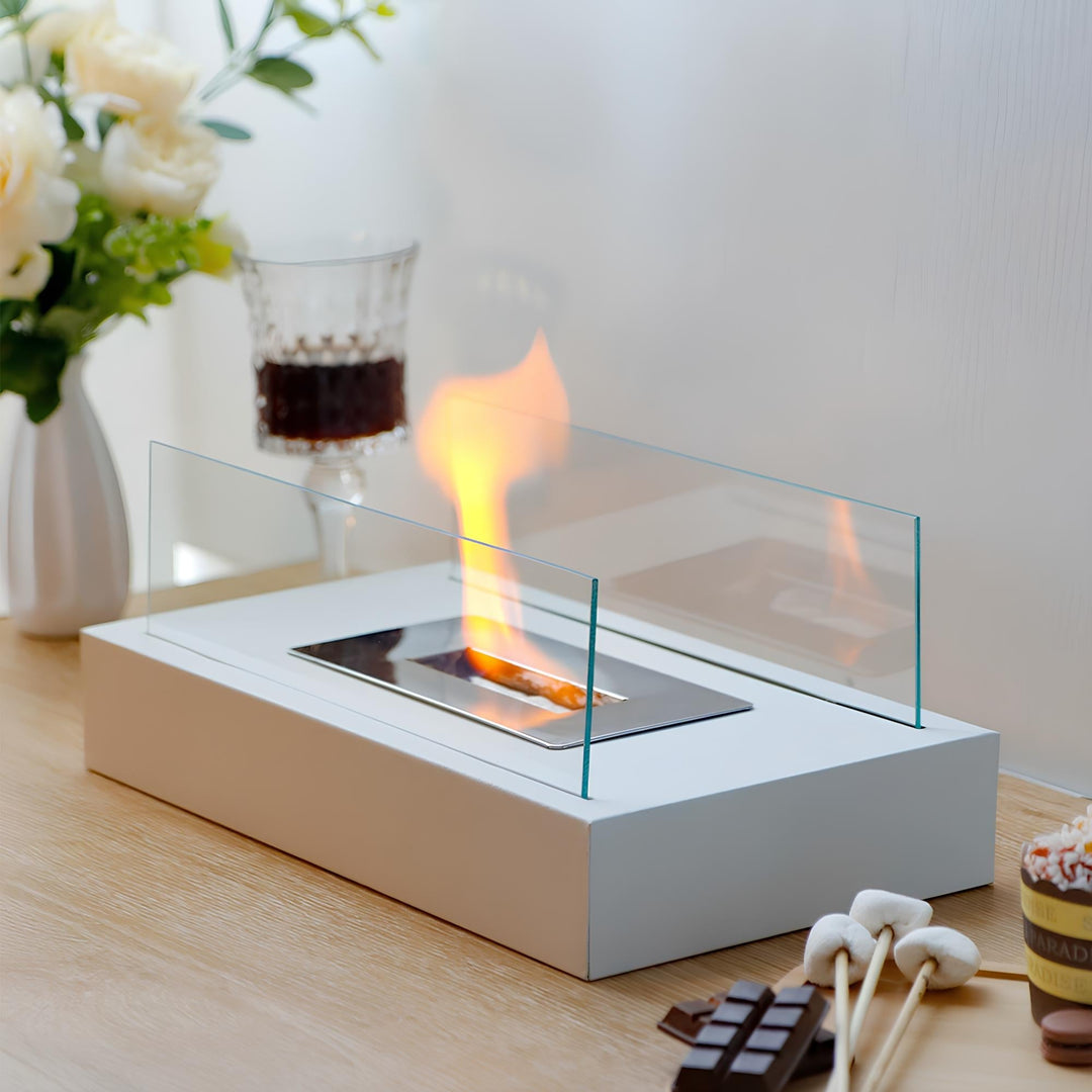 Decorative bio-ethanol fire bowl used as stylish home decor on a wooden surface