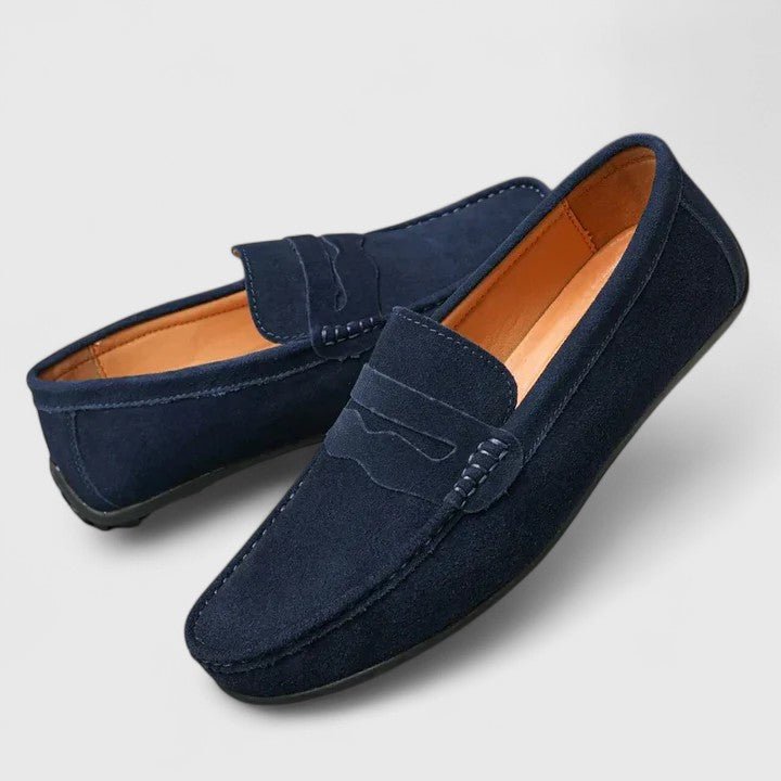 Angled shot of slip-on dress shoes showcasing smooth leather upper design