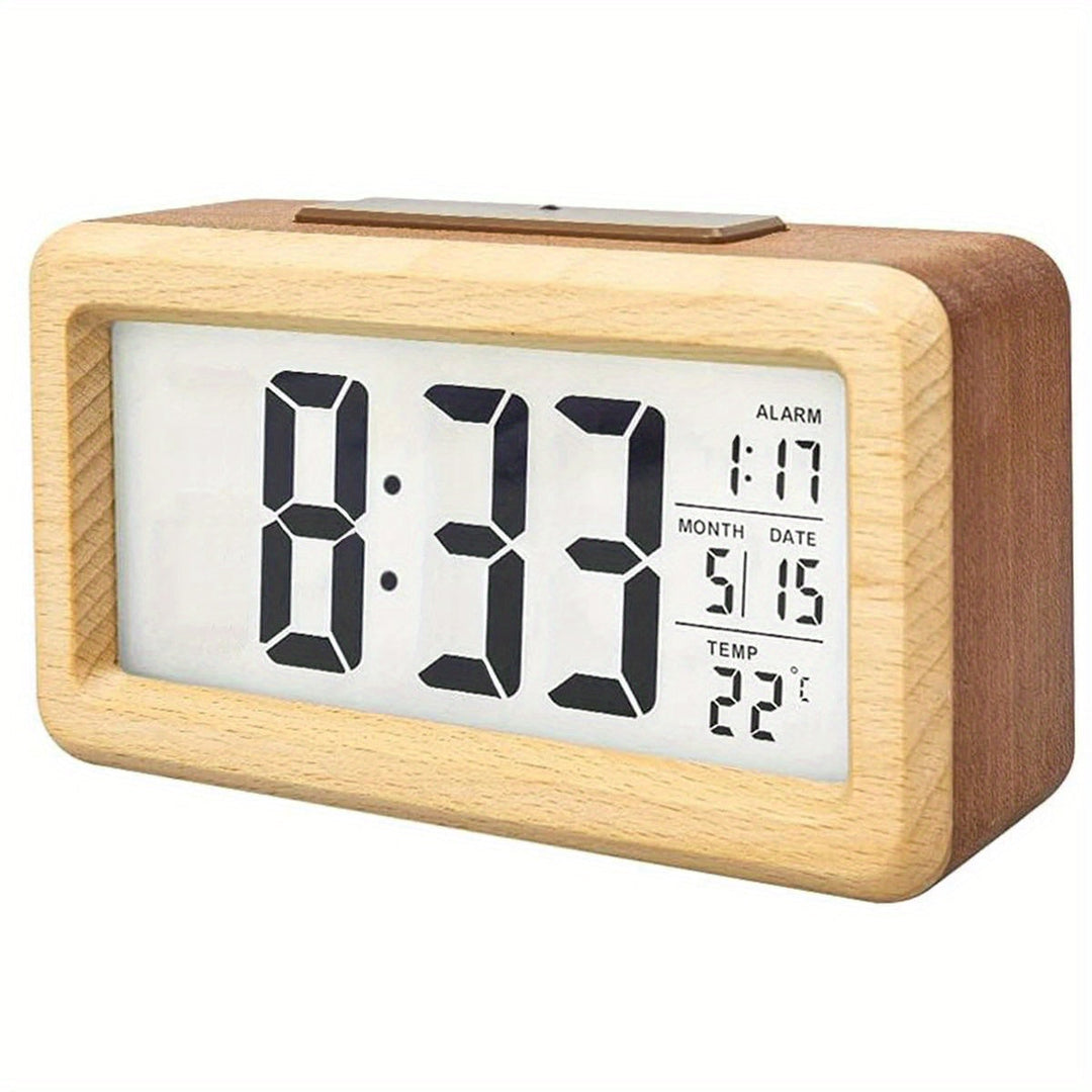 Modern digital wooden alarm clock with clear LED display on bedside table