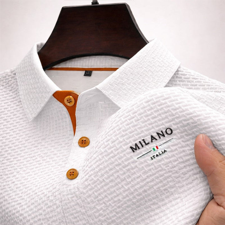 Close up of textured knit fabric on a stylish mens summer polo shirt