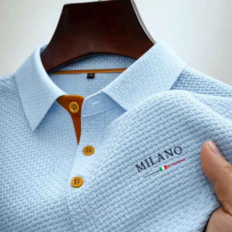 Close-up view of light blue textured knit polo shirt placket and collar